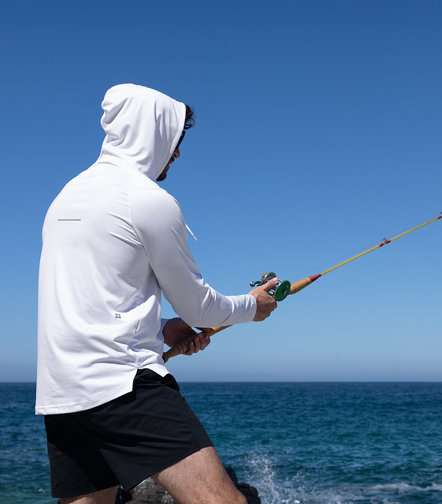 Person wearing a hooded UPF sun protection shirt while fishing outdoors in Australia